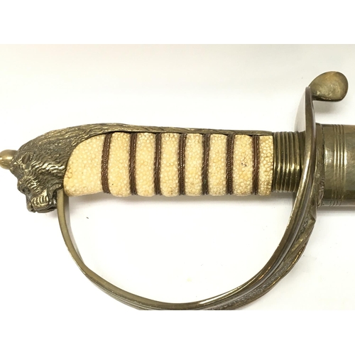 1496 - A naval officers dress sword with a brass hilt, lion head pommel, shagreen grip. 94cm total length. ... 