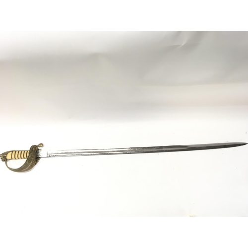 1496 - A naval officers dress sword with a brass hilt, lion head pommel, shagreen grip. 94cm total length. ... 