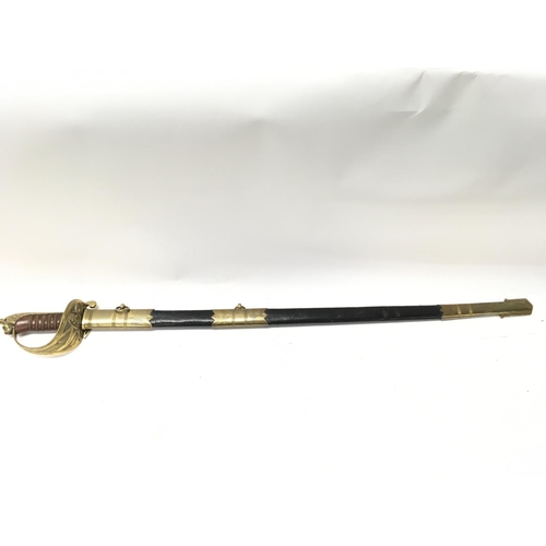 1497 - A 20th century naval officers sword with a brown leather grip. Blade 80cm long. 95cm long in total. ... 