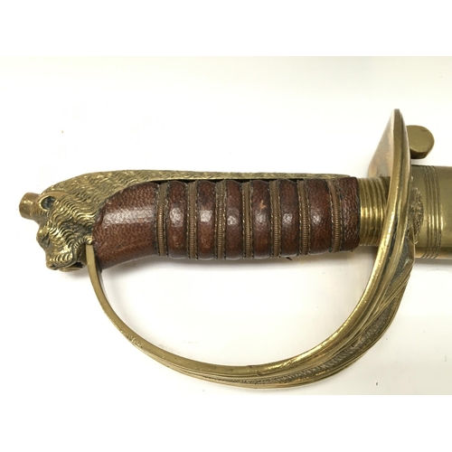 1497 - A 20th century naval officers sword with a brown leather grip. Blade 80cm long. 95cm long in total. ... 