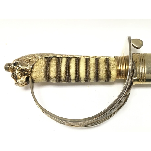 1498 - A modern retrospective copy of a naval officer dress sword , 94cm long. Blade Approx 80cm long. This... 