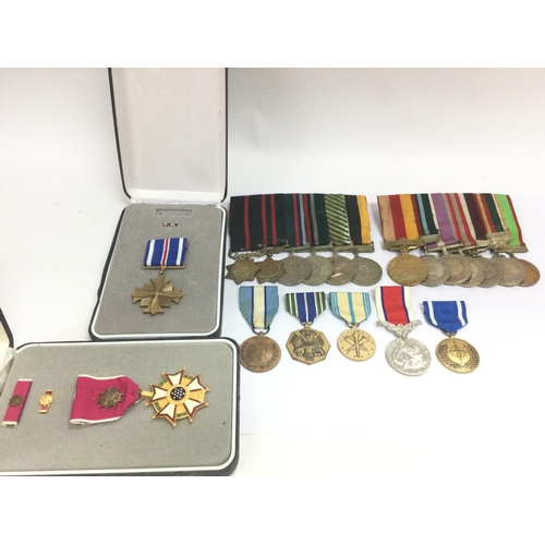 1533 - A collection of various war medals including British Hors De Combat line of duty medal, US armed for... 