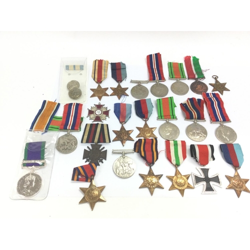 1534 - A collection of WW1 and WW2 medals including Africa, 1939-45, Burma, Italy stars, German Honour cros... 