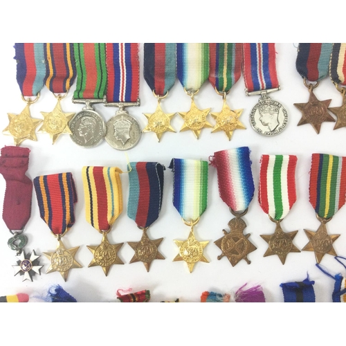 1536 - A collection of miniature war medals including Belgian and British medals. Postage category B