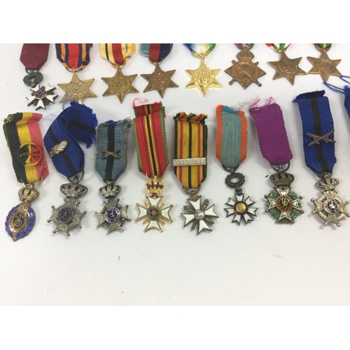 1536 - A collection of miniature war medals including Belgian and British medals. Postage category B