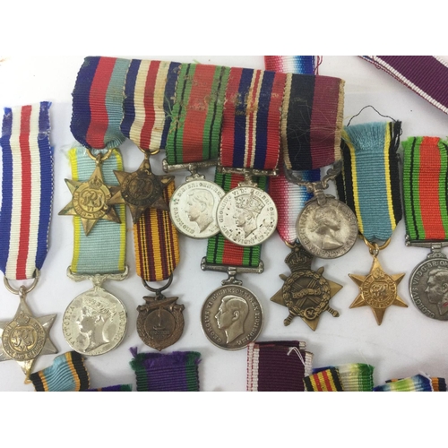 1537 - A collection of miniature British and other war medals including South Africa campaign medal, Braver... 