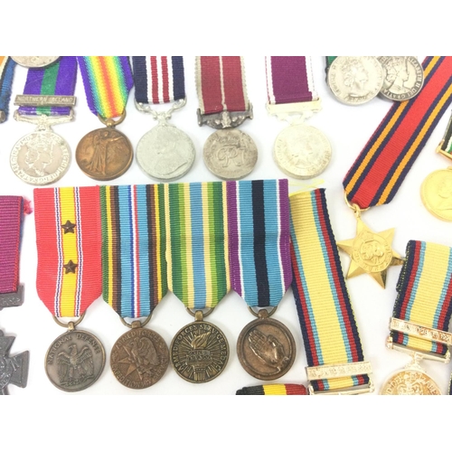 1537 - A collection of miniature British and other war medals including South Africa campaign medal, Braver... 