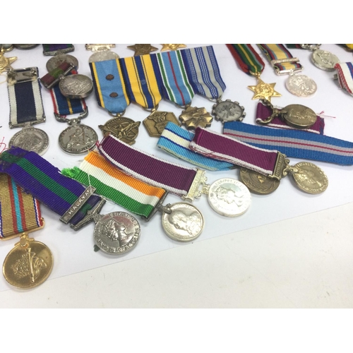 1537 - A collection of miniature British and other war medals including South Africa campaign medal, Braver... 