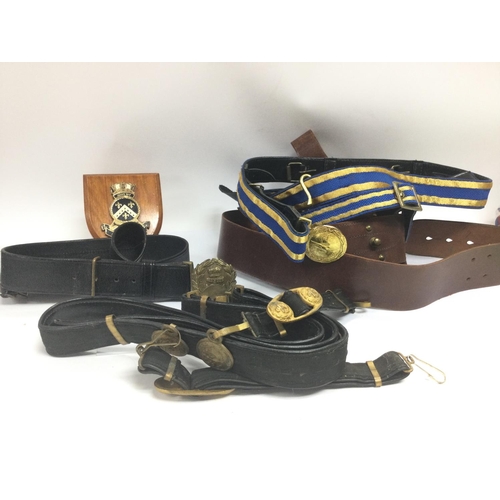 1538 - A collection of leather belts including a Gieves Royal Navy leather belt , Peal & Co London brown le... 