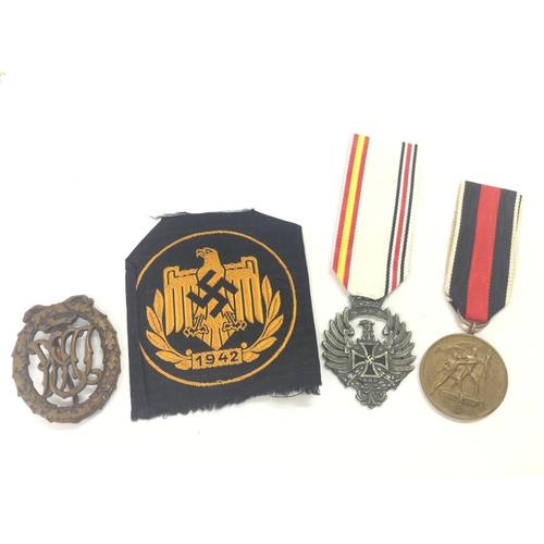 1539 - A collection of Third Reich items including a Sports eagle cloth badge, Sudentenland 1938 medal, DRL... 