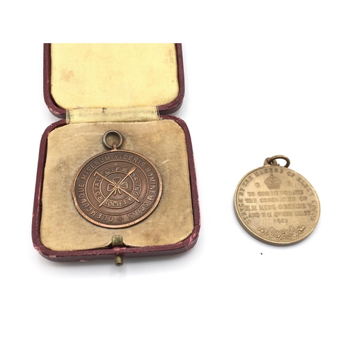 714 - A cased Royal life saving society medal and a 1911 coronation medal.Postage B. NO RESERVE