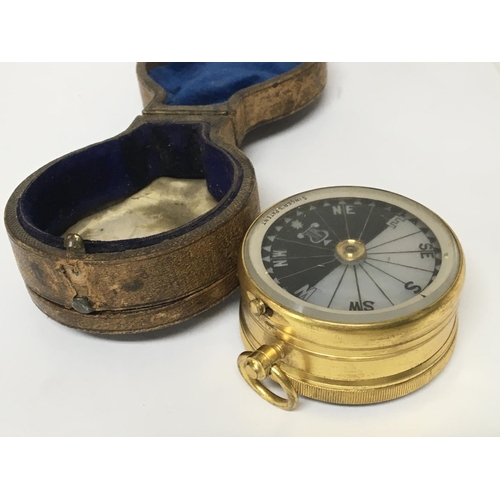 739 - A Quality Victorian gilt metal pocket barometer and compass with makers stamp Singers patent. In a l... 