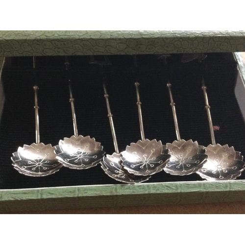 754 - A collection of  four Chinese  silver figures and a cased set of spoons,