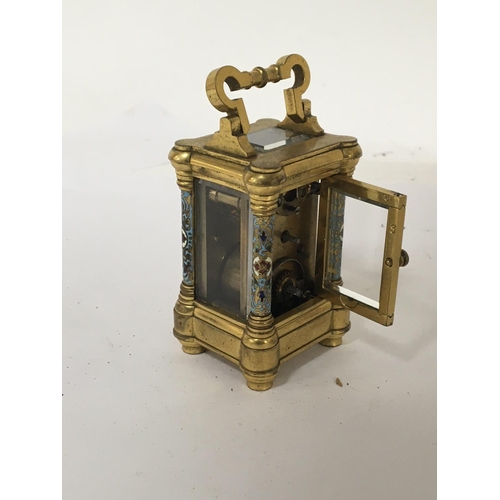 758 - A Quality miniature gilt metal and enamel decorated Carriage clock with raised floral decoration Hei... 