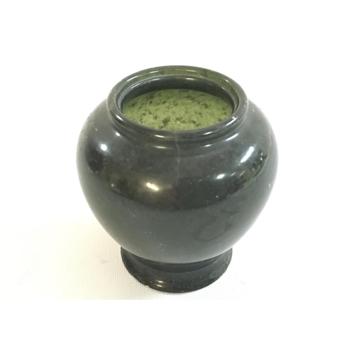 801 - A Chinese miniature Spinach jade vase, 6cm tall this lot cannot be posted. Small chip on the base. N... 