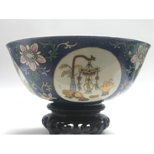 827 - A Chinese Blue Ground Famille Rose bowl ,6cm tall 15cm wide. This lot cannot be posted