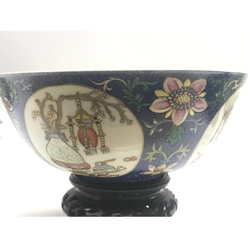 827 - A Chinese Blue Ground Famille Rose bowl ,6cm tall 15cm wide. This lot cannot be posted