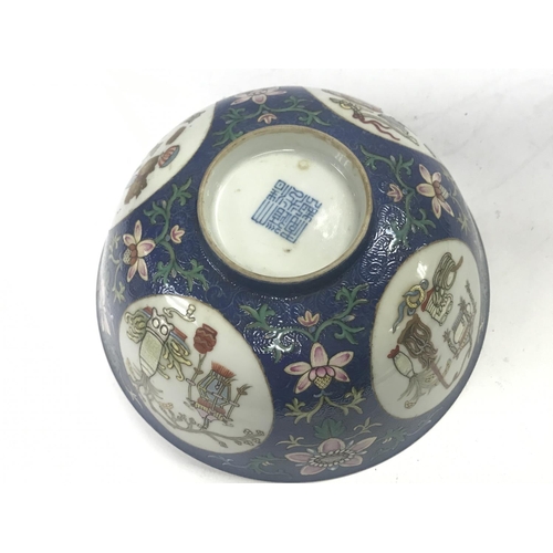 827 - A Chinese Blue Ground Famille Rose bowl ,6cm tall 15cm wide. This lot cannot be posted