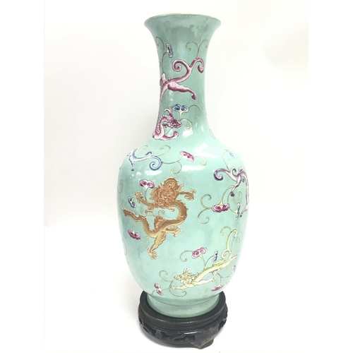 833 - A Chinese Famille Rose Turquoise ground dragon vase , with six character mark to the base. Approxima... 