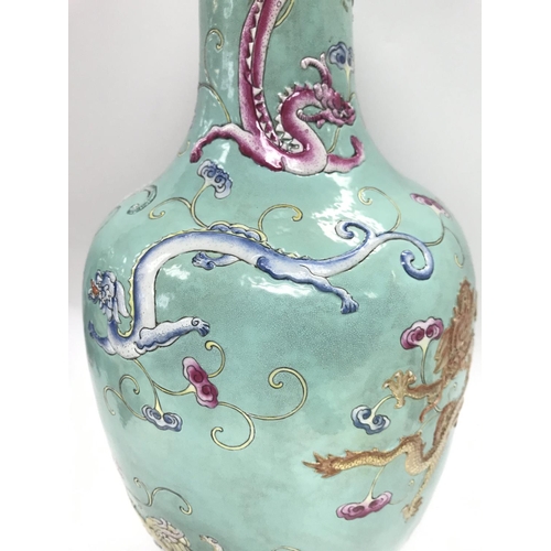 833 - A Chinese Famille Rose Turquoise ground dragon vase , with six character mark to the base. Approxima... 