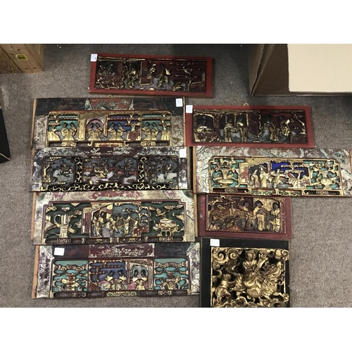 835 - A Collection of Chinese carved wooden panels. Postage category C