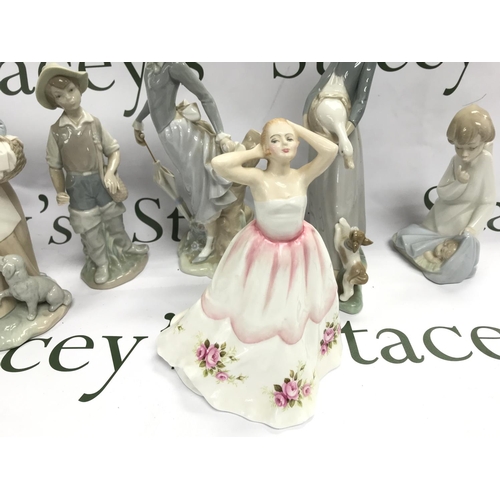 1011 - A Collection of porcelain figures including Lladro, Nao and a Royal Doulton figure, Claire HN3209. 8... 