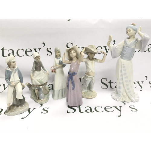 1013 - A Collection of porcelain figures including Lladro, Nao, Porcegama Valencia etc. 23 to 34cm tall. Th... 