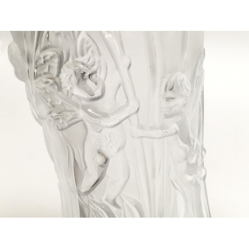 1018 - A Lalique glass vase decorated with Putto and flowers. 19.5cm tall. This lot cannot be poted