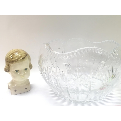 1030 - A ceramic doll head and a cut glass bowl . 13 and 15cm tall. This lot cannot be posted. NO RESERVE