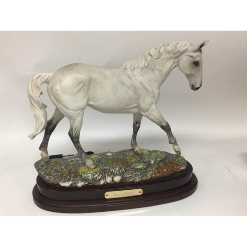 1035 - A Royal Doulton ceramic figure of Desert Orchid limited edition on a mahogany base. Hight 32cm no ob... 