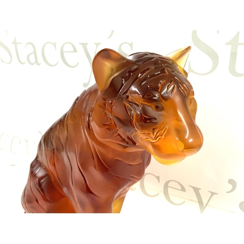 1060 - A large Lalique Amber glass tiger, 20th century, seated, overall decorated with black stripes, heigh... 