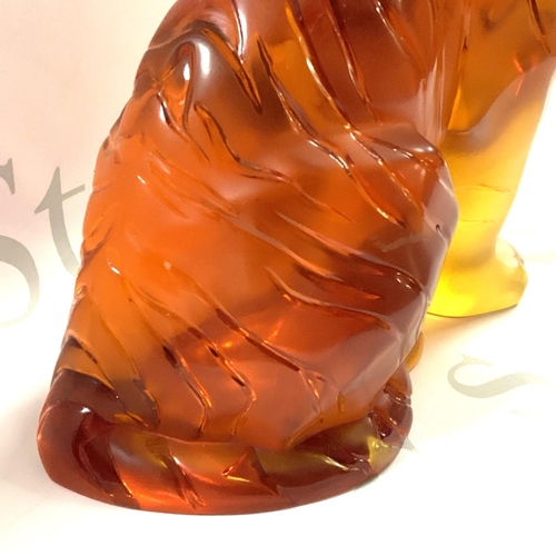 1060 - A large Lalique Amber glass tiger, 20th century, seated, overall decorated with black stripes, heigh... 