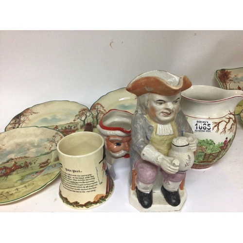 1065 - A 19th century ceramic Toby jug a Crown Devon musical jug and six Royal Doulton plates depicting hun... 