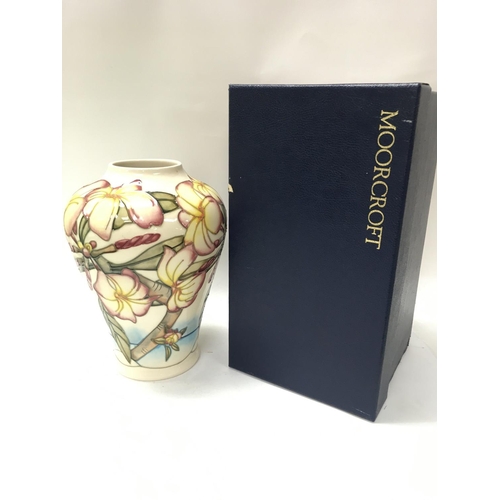 1076 - A boxed Moorcroft Frangipani vase, 22cm tall. No obvious large damage or restoration. This lot canno... 