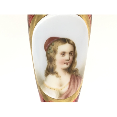 1084 - A Victorian Bohemian Cranberry portrait vase with gilt decoration , 22cm tall. This lot cannot be po... 