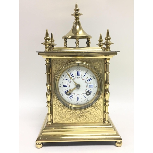 1306 - A French brass mantel clock maker S Marti with ornate engraved decoration and a painted porcelain ro... 