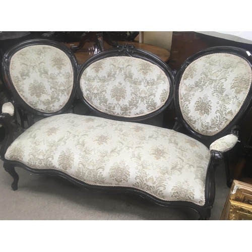 1310 - A double ended Victorian sofa with upholstered back and seat on cabriole legs .