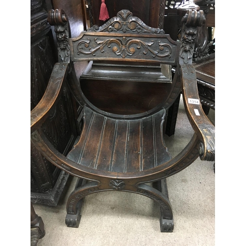 1314 - A oak carved open arm chair the solid seat on x framed stretchers .