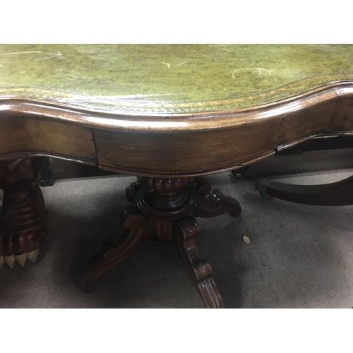 1318 - A Victorian walnut occasion table the shaped top above a single drawer on a turned column and shaped... 