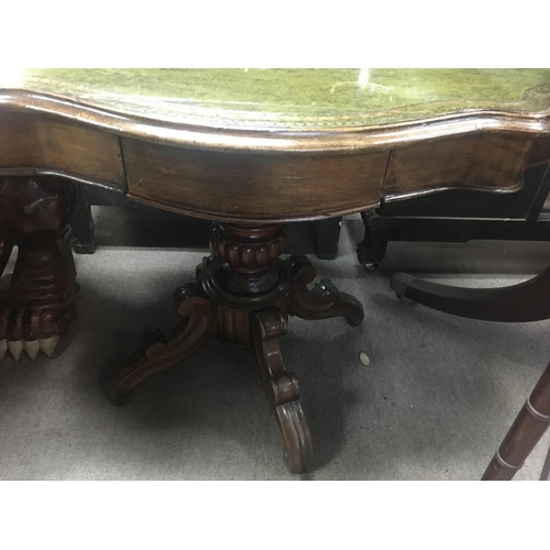 1318 - A Victorian walnut occasion table the shaped top above a single drawer on a turned column and shaped... 