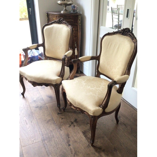 1321 - A pair of quality French Louis XVI style carved wood open arm chairs the top rail with folate scroll... 