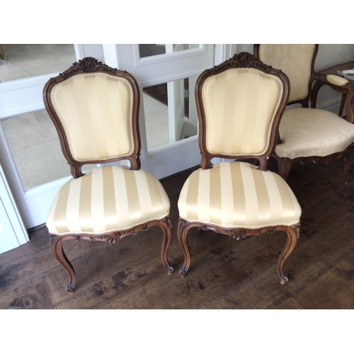 1322 - A pair of conforming French Louis XVI style matching chairs with carved top rail tastefully upholste... 