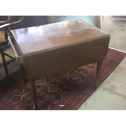 1397 - A Mahogany Pembroke table the twin flap top with boxwood banding fitted with an oak lined drawer.