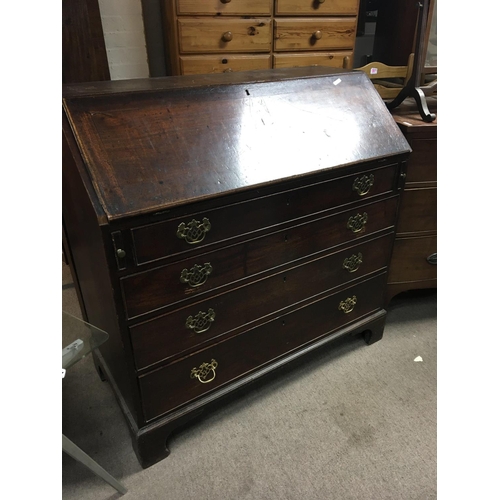 1408 - A George III mahogany bureau with a well fitted with small drawers and hidden compartments above fou... 