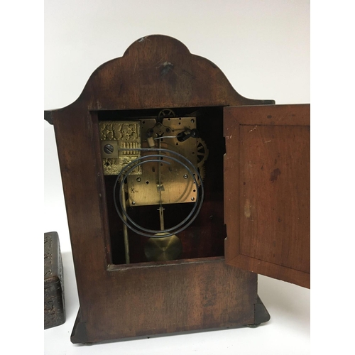 1415 - An Early 20th century walnut clock with an enamel dial. and a profusely carved and inlaid box (2)