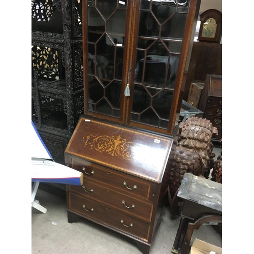 1431 - A Edwardian mahogany inlaid bureau bookcase with a pair of glazed doors above a fall front with thre... 