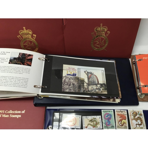 1889 - A collection of yearly isle of man stamp collection packs along with other presentation packs and lo... 