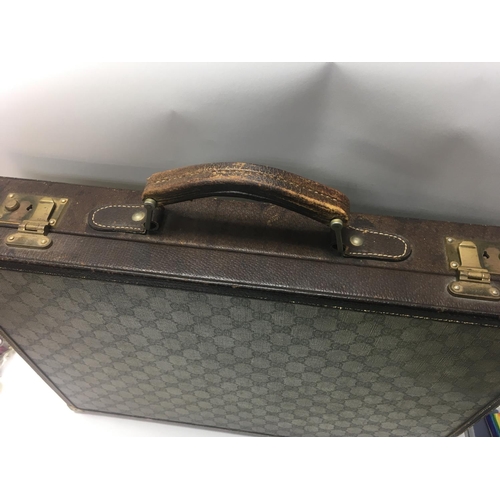 2016 - A Gucci 66 pattern canvas briefcase case with key .