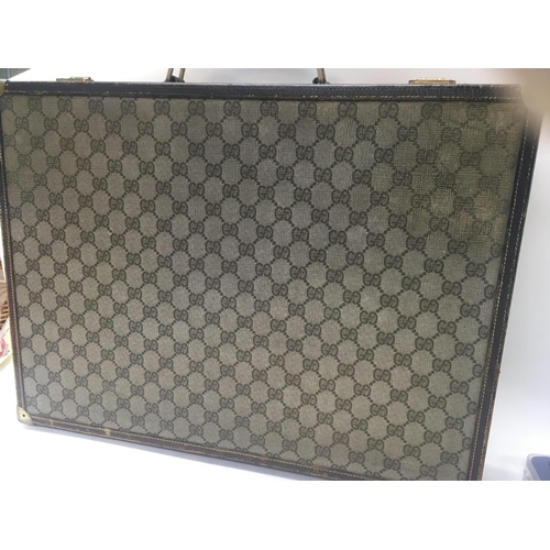 2016 - A Gucci 66 pattern canvas briefcase case with key .