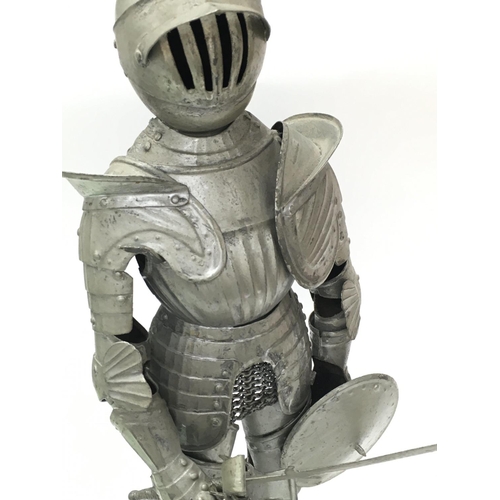 2022 - A miniature Medieval suit of armour with longsword and shield , 43cm tall. Postage category C